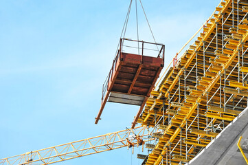 Crane and highrise construction site
