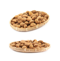 Wicker basket of almond nuts isolated
