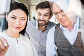Joyful men and woman resting in office