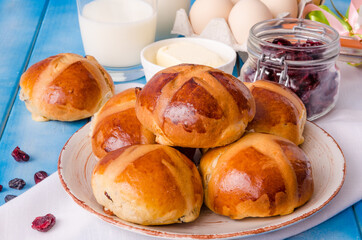 Easter hot cross buns with dried cranberries and raisins