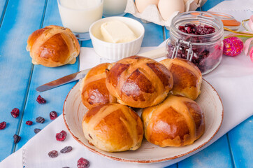 Easter hot cross buns with dried cranberries and raisins