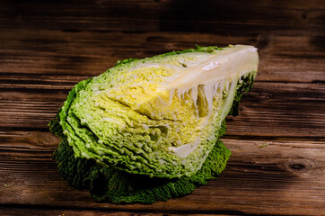 Savoy cabbage on wooden table
