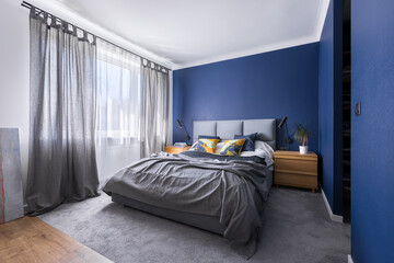 Cobalt blue bedroom with bed