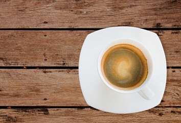 Top view shot of espresso coffee cup on wood table
