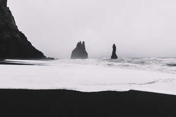 Naklejka na ściany i meble Beautiful black sand beach in Iceland with basalt formations and view on Atlantic ocean