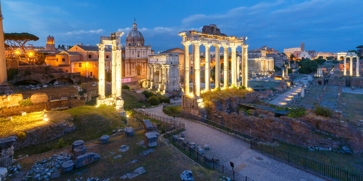 Ancient ruins of a Roman Forum or Foro Romano during evening blue hour in Rome, Italy. Panoramic view from Capitoline Hill