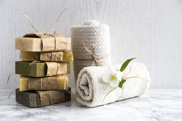 Spa treatments with natural soap and towels - obrazy, fototapety, plakaty