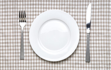 Empty white plate with fork and knife