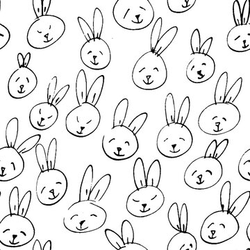 Cute rabbit face pattern. Seamless hand drawn background.