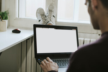 young working comfortably with the laptop man