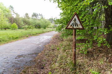 decayed crosswalk sign in chernobyl