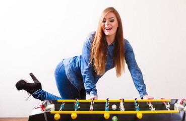woman playing table football game