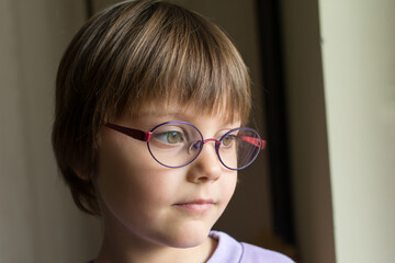 Beautiful little girl with intelligent eyeglasses