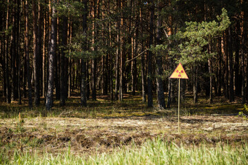 radioactive warning sign at the red forest in chernobyl	
