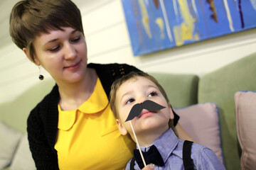 Kid with toy moustache