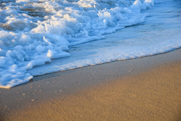Waves breaking on a sandy beach