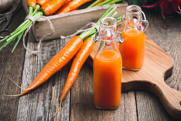Fresh carrot juice in bottles