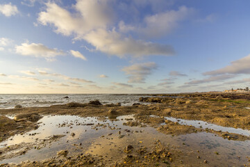 Cloundscape Atlantic Ocean view at Dar Bouazza rocky beach, in Casablanca south coast.