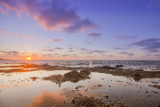 Sunset Atlantic Ocean view at Dar Bouazza rocky beach, in Casablanca south coast.