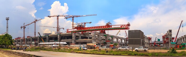 Fototapeta na wymiar Panorama of Construction site with crane under blue sky