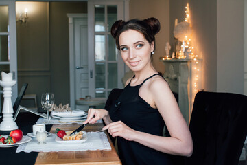 Woman Breakfast of waffles with a coffee table in the living roo
