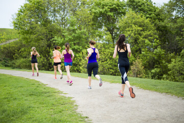 Obraz premium group of people enjoying in the fitness having fun running outside