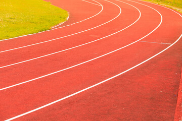 Red running track in stadium.