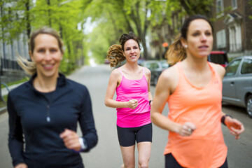 Fototapeta premium group of people enjoying in the fitness having fun running outside