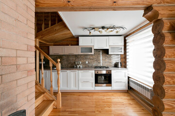 The kitchen room in a rustic log cabin, in the mountains. with a beautiful interior. house of pine...