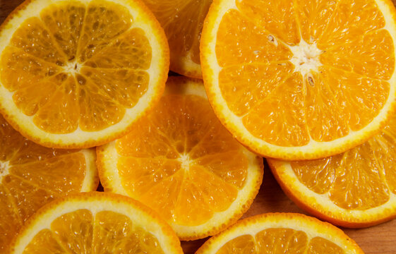 Background of sliced juicy oranges fruit