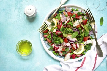 Summer colorful vegetable salad with chicken and mint.Top view.