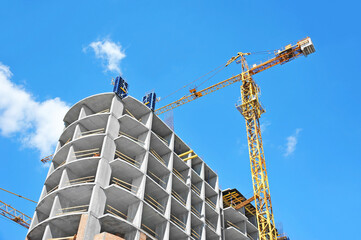 Crane and highrise construction site