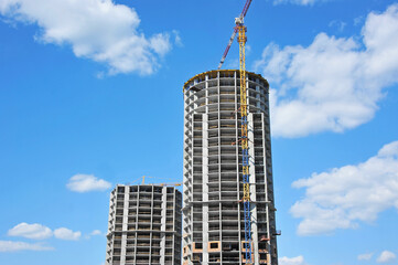 Crane and highrise construction site