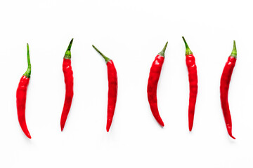 red hot chili pepper design on white table background top view