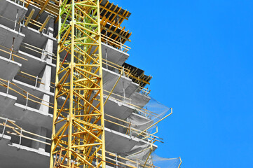 Crane and highrise construction site