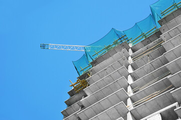 Crane and highrise construction site