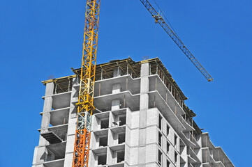 Crane and highrise construction site