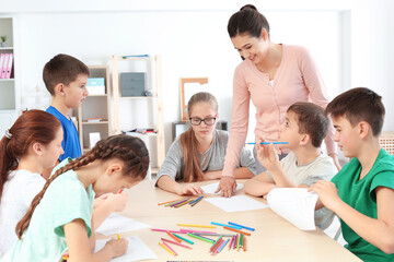 Female teacher conducting lesson in classroom