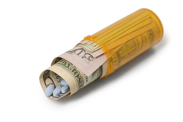 Money and pills rolled up in Prescription container - Laying down