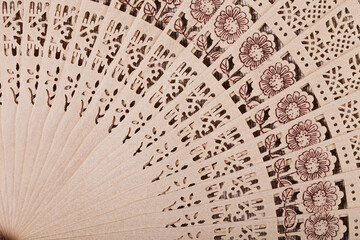 Wooden fan close-up geometric pattern