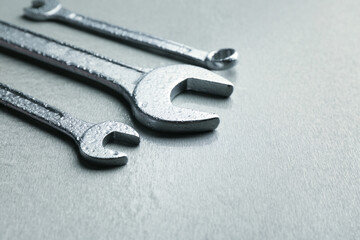 Combination wrenches and spanner on light background