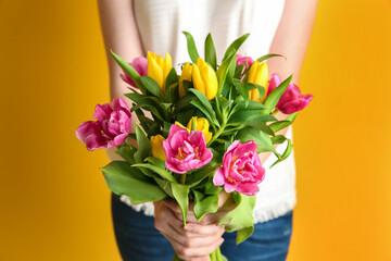 Fototapeta na wymiar Woman holding beautiful bouquet of tulips, closeup
