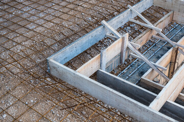 Boarding frame prepared for pouring concrete on reinforcement mesh for the stairs