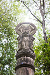 Asoka concrete pillar under tree shade, Budhism symbolic and believe