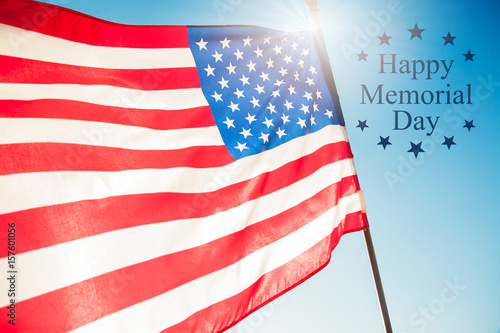 Happy Memorial Day Greeting, USA patriotic flag on blue sky and sunlight background with text Happy Memorial Day.