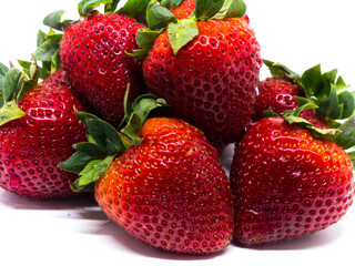 Closeup shot of fresh strawberries. Isolated on white background.