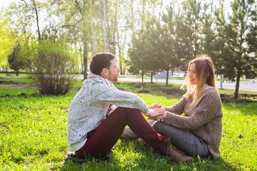 Fototapeta premium Happy pregnant woman and her husband in the park