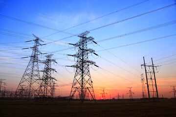 The silhouette of high voltage towers