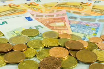 Banknotes and coins in euros as a background