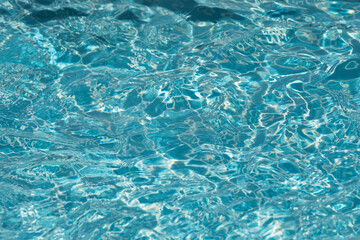Fototapeta na wymiar Close-up purified water surface and motion, Selective focus water surface in swimming pool
